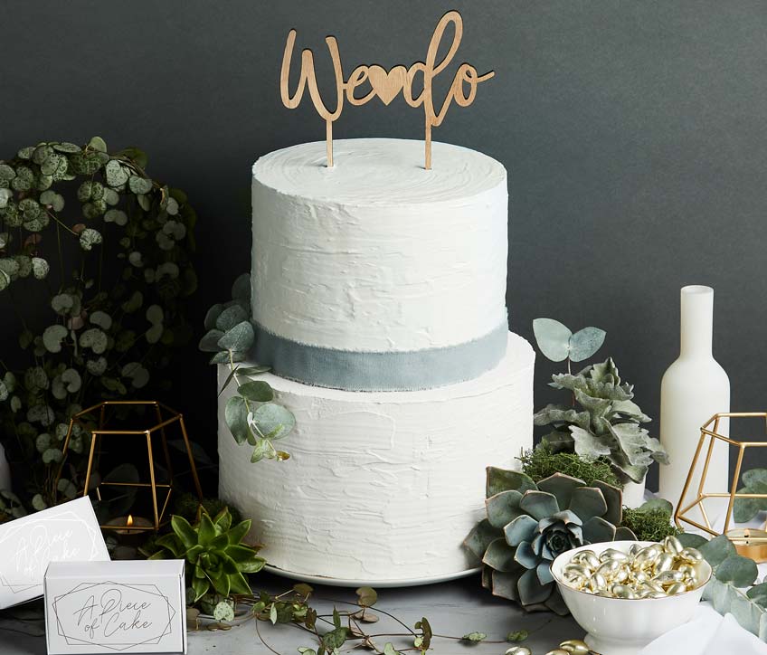 Ein schönes Symbol zur Verlobungsfeier - Der Cake-Topper "We do"